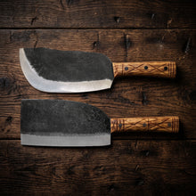 Mammoth hand forged butcher cleaver shown in a group of cleavers for boning